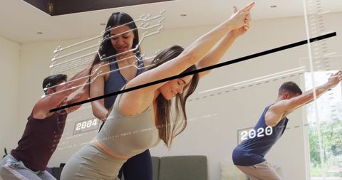 Women stretching with trainer at home using augmented reality fitness overlay and tracking