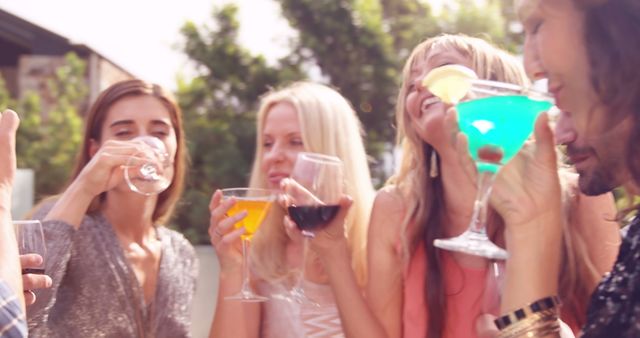 Group of Friends Enjoying Colorful Cocktails at Sunset - Download Free Stock Images Pikwizard.com