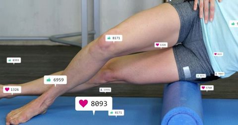 Woman rolling thighs on foam roller with social likes overlay for recovery and mobility