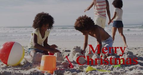Children Building Sandcastles Beach Christmas Celebration
