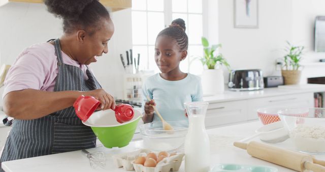 Happy African American Grandmother and Granddaughter Baking Together in Kitchen - Download Free Stock Images Pikwizard.com
