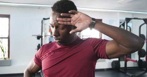 Focused Athlete Cooling Down After Intense Gym Workout