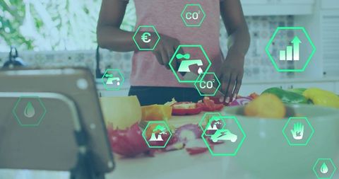 Woman chopping vegetables in smart kitchen with sustainability icons and analytics overlay