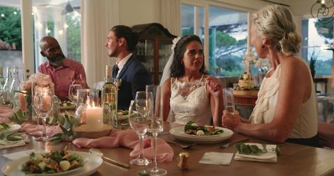 Elegant Wedding Reception Dinner with Bride, Groom and Guests