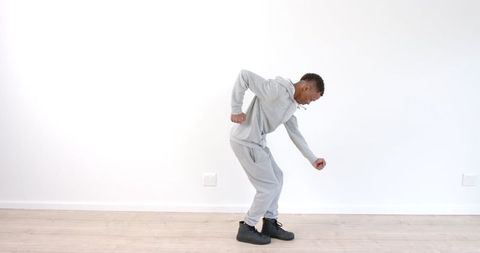Energetic Dance Performance in Minimalist Room