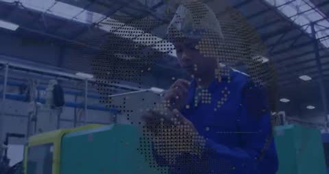 Technician Engaging with Analytics in High-Tech Manufacturing Facility