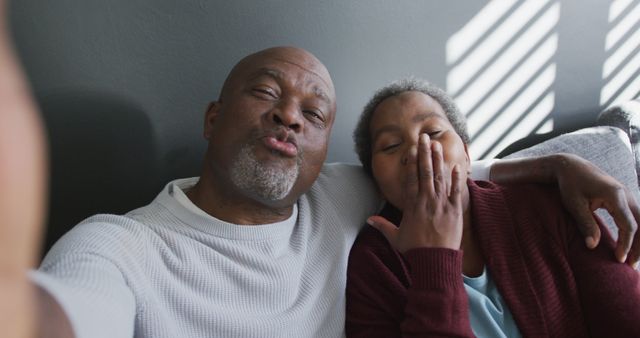 Happy Senior Couple Taking Selfie on Couch - Download Free Stock Images Pikwizard.com