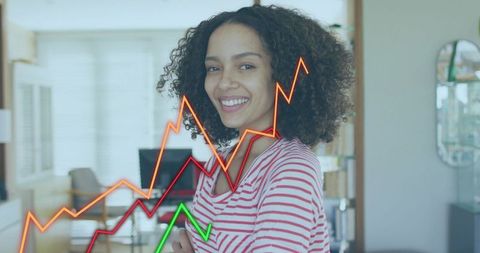 Smiling young professional woman working from home showing rising digital growth graphs