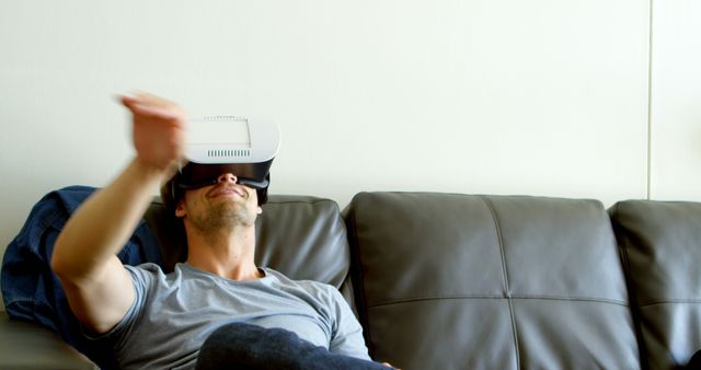 Ideal for showcasing advancements in home entertainment technology, promoting virtual reality headsets, or highlighting the immersive VR experience in a casual home environment.