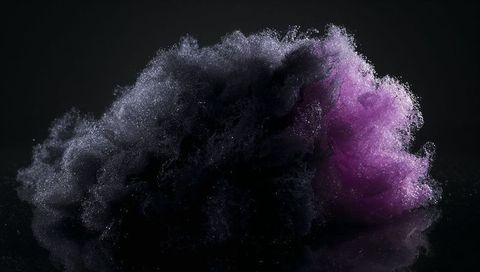Billowing magenta and dark particle cloud hovering over glossy black plane, sparkling dust