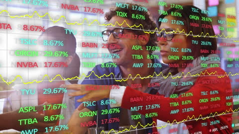Team Analyzing Financial Trends with Stock Market Data Overlay