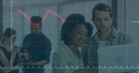 Colleagues Analyzing Financial Data on Digital Interface in Office