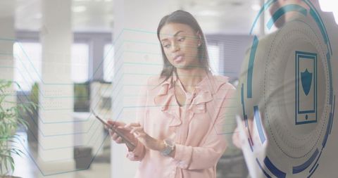 Professional using tablet for cybersecurity collaboration with holographic hud in office