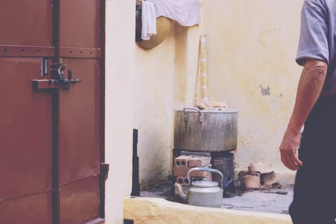 Traditional outdoor cooking scene in rustic setting