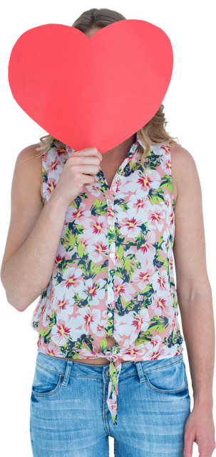 Woman holding up large red heart-shaped card against white background, showing flowers shirt - Download Free Stock Videos Pikwizard.com