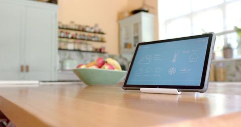 Smart Home Tablet Display on Kitchen Table - Download Free Stock Images Pikwizard.com