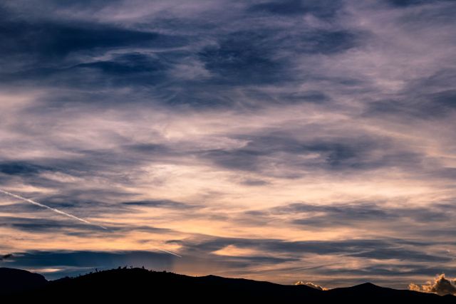 Dramatic Evening Sky with Silhouetted Mountain Ridge - Download Free Stock Photos Pikwizard.com