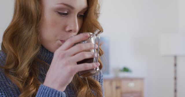 Young Woman Drinking Refreshing Beverage Indoors - Download Free Stock Images Pikwizard.com