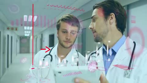 Doctors Analyzing Data on Tablet in Hospital Hallway