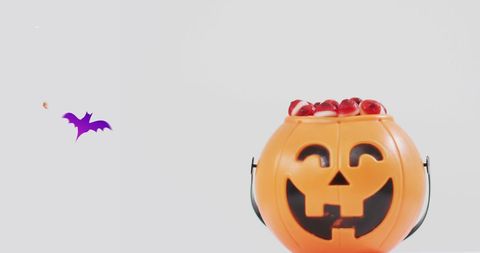 Halloween Pumpkin Bucket Filled with Sweets and Fake Eyeballs - Download Free Stock Images Pikwizard.com