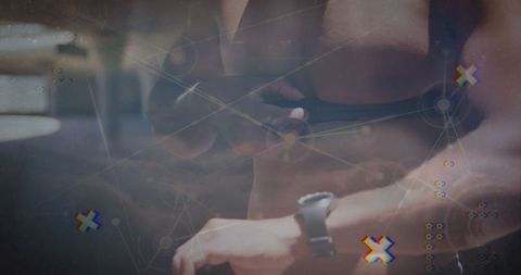 Athlete Using Fitness Watch Focusing on Arete Training at Gym with Technology Overlay