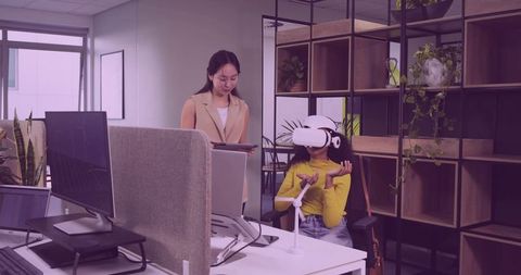Female Professional Exploring Virtual Reality in Modern Office