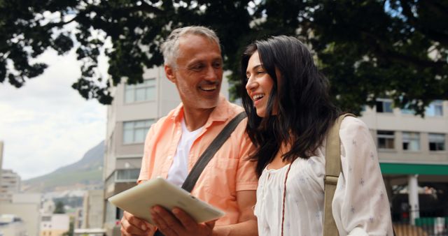 Joyful Couple Exploring City with Tablet - Download Free Stock Images Pikwizard.com