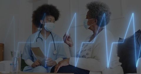 Nurse providing telehealth service to senior with ecg overlay