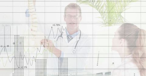 Doctor explaining spine model with graph overlay in clinical section