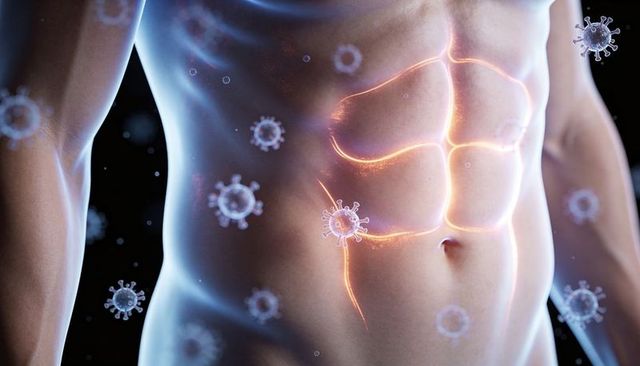 Male torso with glowing abdominal anatomy and floating virus particles, infection concept
