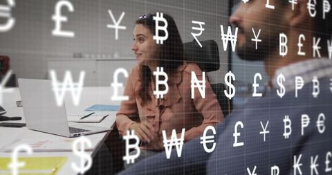 Woman reviewing fintech data while collaborating with colleague, currency symbols overlay