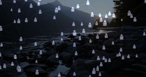 Digital social network overlay connecting avatars across mountain lakeshore at sunset