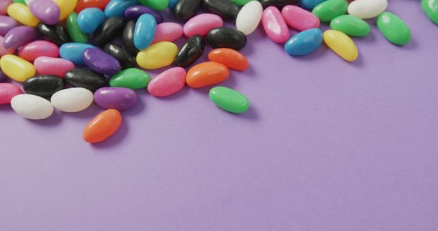 Colorful Candy Jelly Beans on Purple Surface - Download Free Stock Images Pikwizard.com
