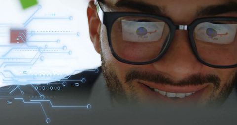 Man analyzing data with digital interface reflecting on glasses