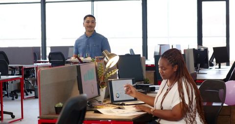 Colleague Surprising Coworker with Birthday Cake in Modern Office