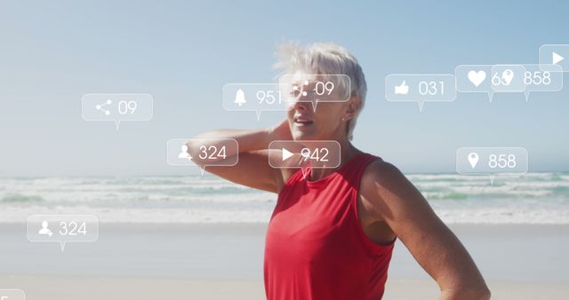 Active Mature Woman Running on Beach with Social Media Notifications - Download Free Stock Images Pikwizard.com