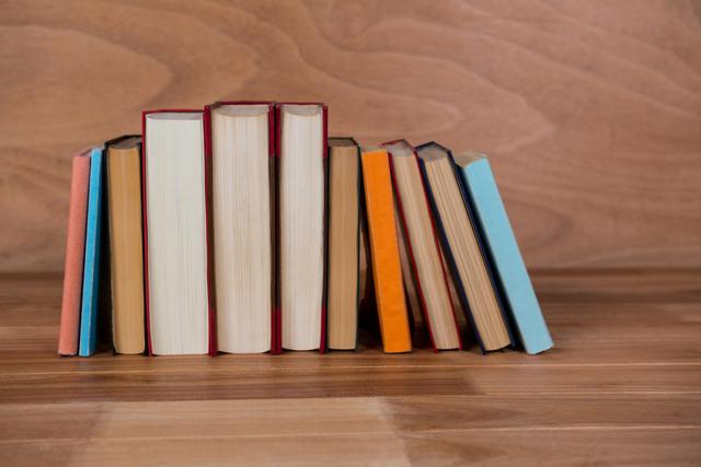 Books Arranged on Wooden Table with Wooden Background - Download Free Stock Photos Pikwizard.com