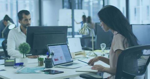 Woman Collaborating in Modern Office with Technology