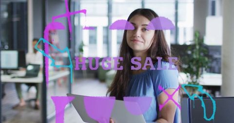 Confident Woman with Laptop in Open-Plan Office Setting