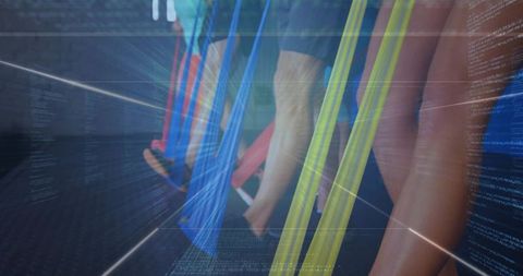 Suspending legs in colorful aerial slings for group fitness, motion blur studio scene