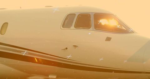 Luxurious private jet in golden hour on tarmac with sensors
