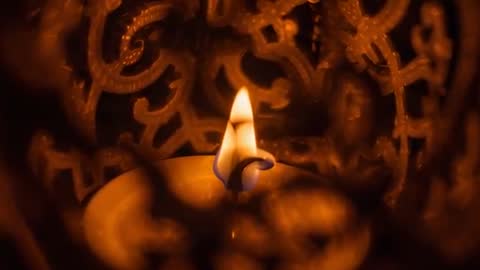 Intricate Lantern Casting Shadows by Candlelight