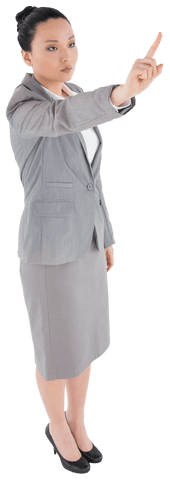 Asian Businesswoman Pointing in Corporate Attire on Transparent Background