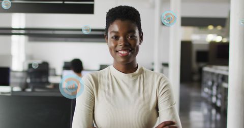 Confident Businesswoman in Modern Office with Digital Interface Overlays