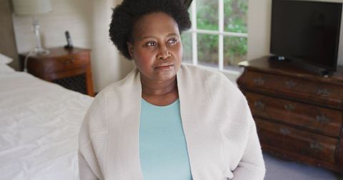 Thoughtful Senior Woman Reflecting at Home Interior