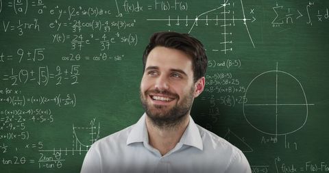Smiling Man Contemplates Mathematical Graphs on Chalkboard - Download Free Stock Images Pikwizard.com