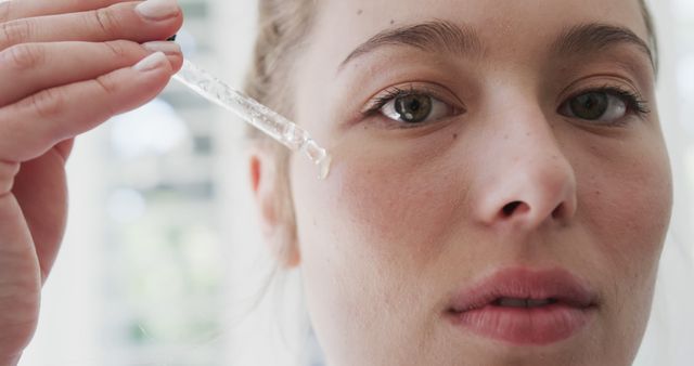 Close Up of Woman Applying Serum with Dropper for Skincare - Download Free Stock Images Pikwizard.com