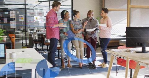 Diverse team discussing data visualization in modern office