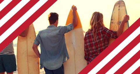 Friends Holding Surfboards With USA Flag Overlay at Beach