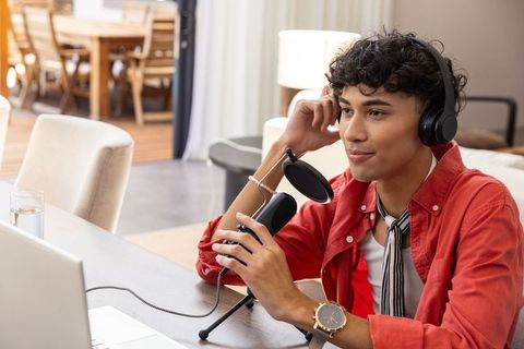 Aspiring Podcaster Recording Content at Home Studio